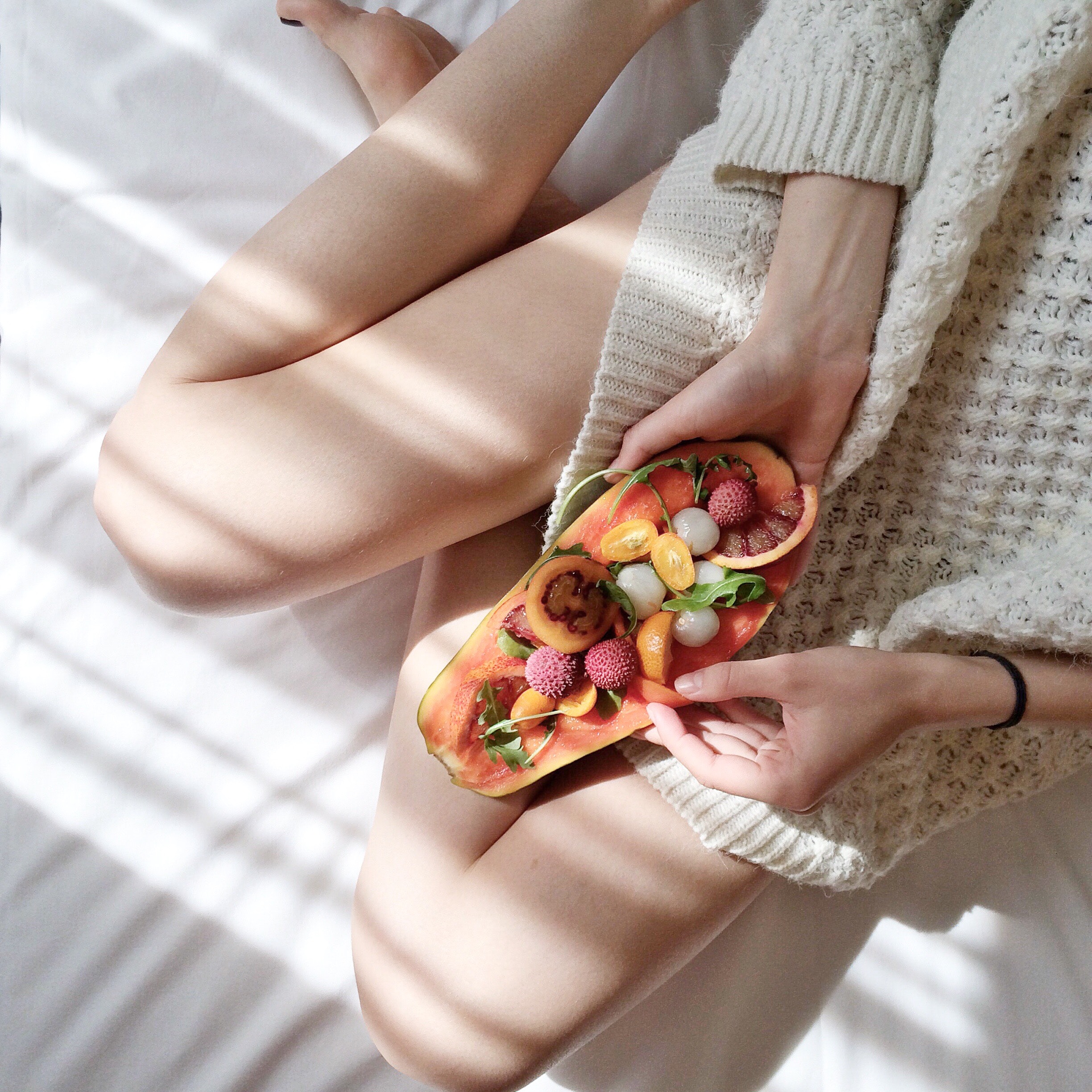 person-holding-papaya-fruit-on-bed-1030870 (1)